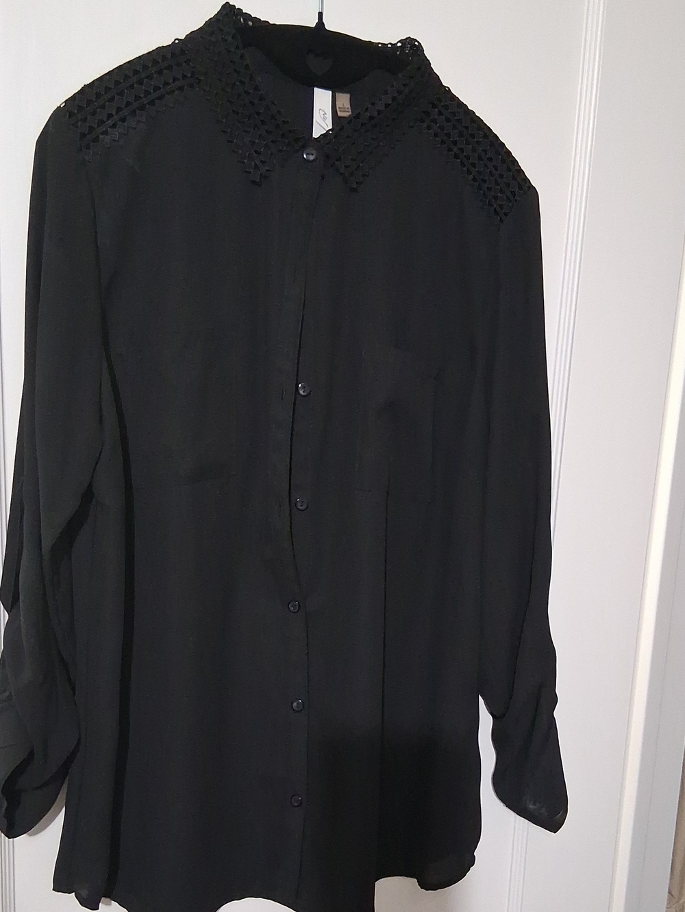 Black Women's blouse with detailed caller and shoulders.